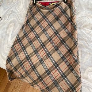 Plaid, wool skirt. Hits below knee.